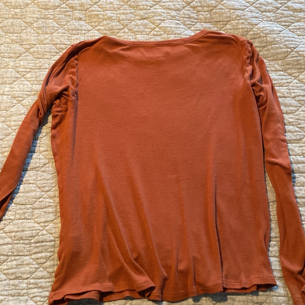 Love this color!  Long sleeve, very small fine ribbed rust tshirt